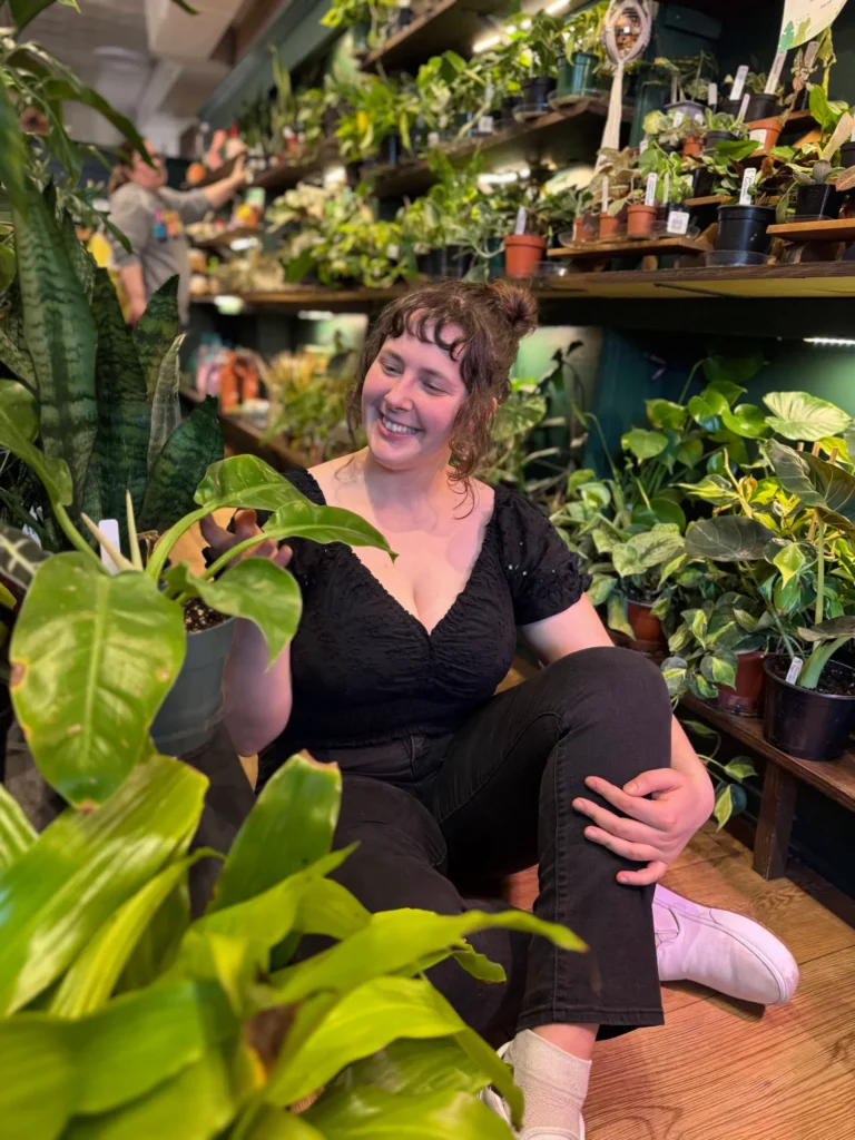 Julia 4 Julia sitting in a plant shop looking at the plants